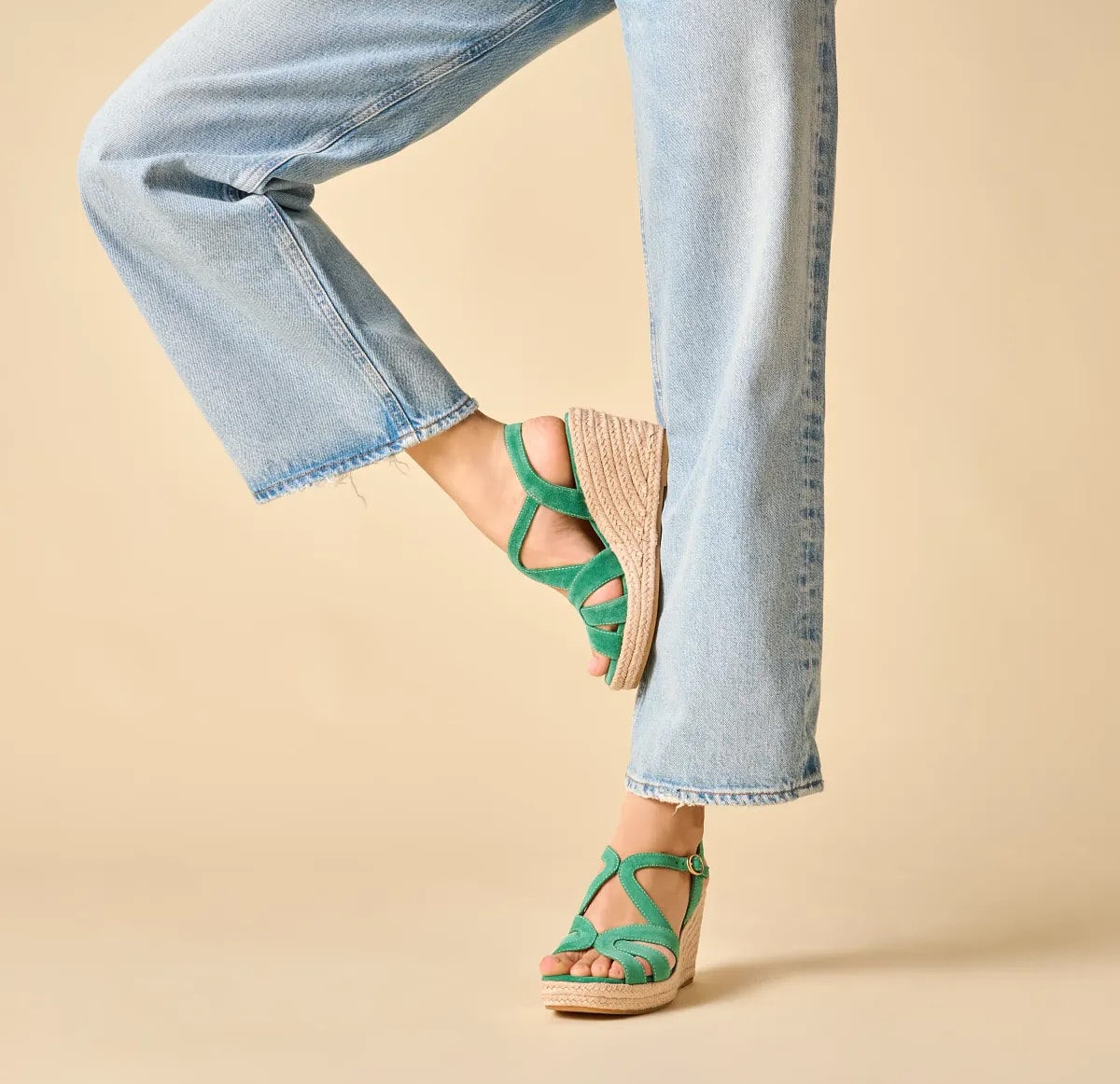 Featuring the Norma wedge sandal in green.