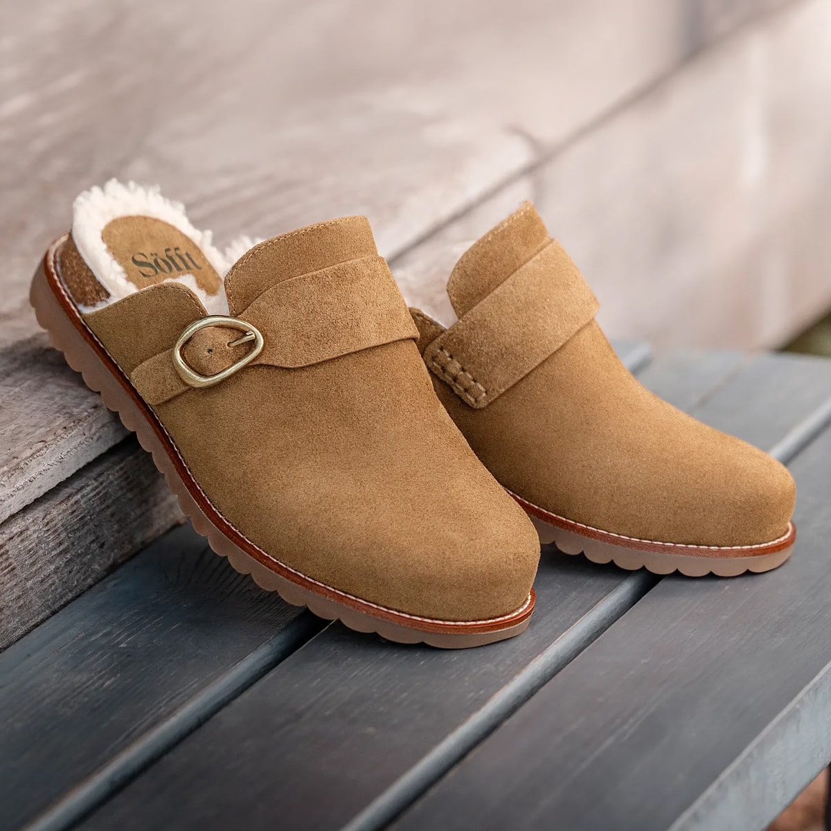 Featuring the Angela shearling clog in tan suede.