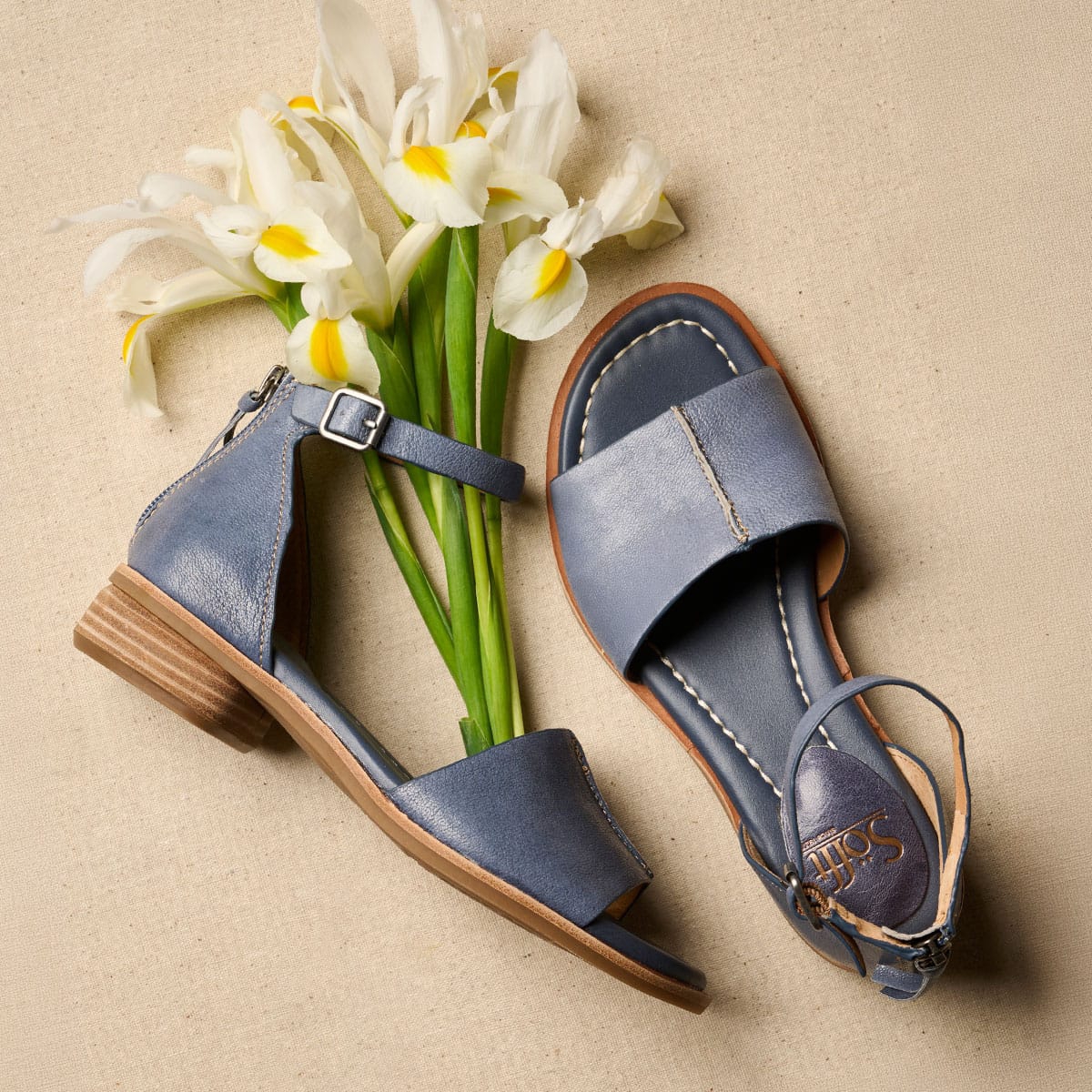 Faxyn ankle strap sandal in blue with flowers.