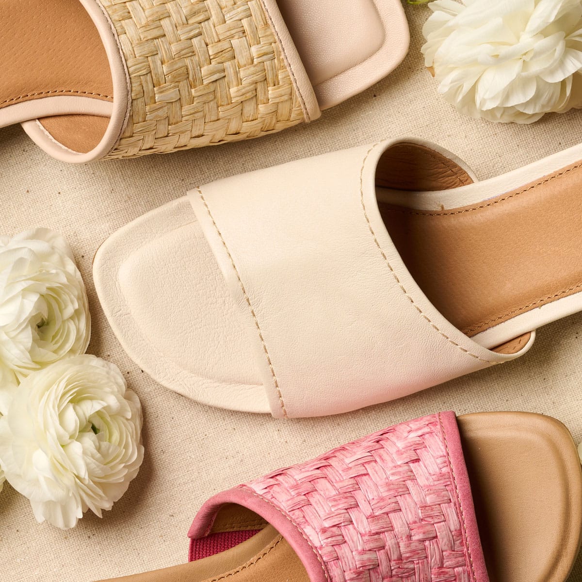 Sahara slide sandal in white, tan and pink with flowers.
