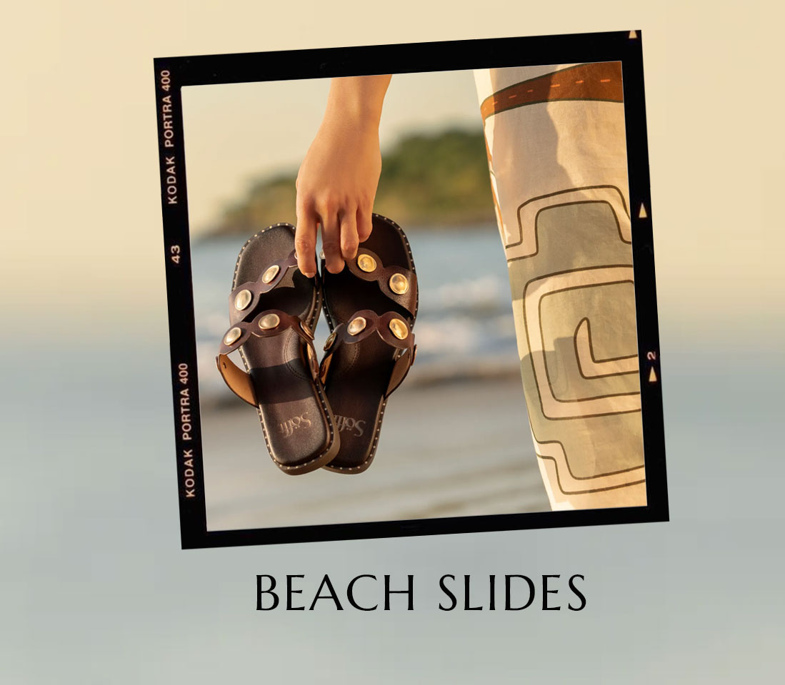 Beach Slides/ Featuring the Ezra slide sandal in brown.
