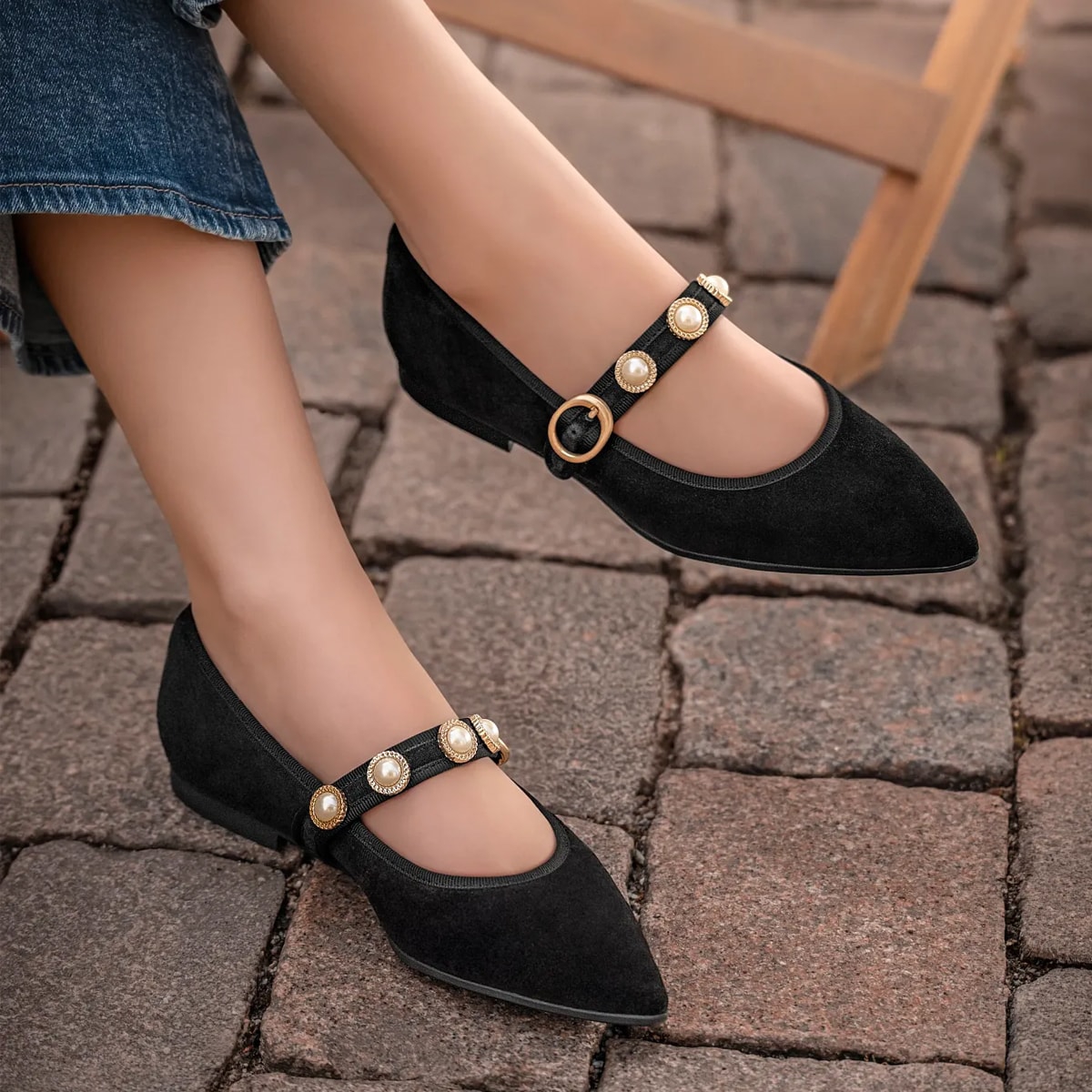 Featuring the Mallory flat mary jane in black suede.