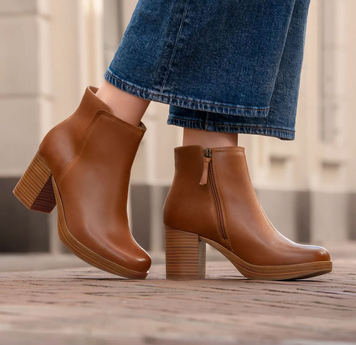 Featuring the Kendall heeled side-zip bootie in brown.